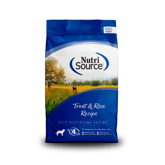 A bag of Nutri Source Trout & Rice Recipe dry dog food with a picture of a dog in the field and a cow in the background.
