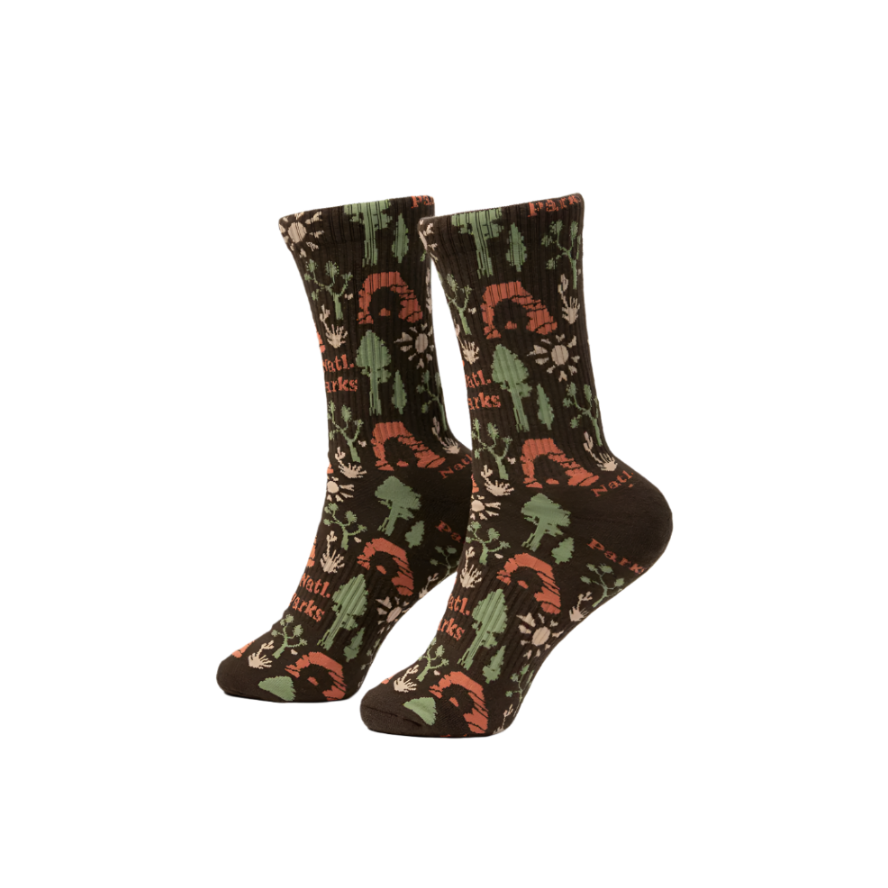 A pair of socks with a camouflage pattern featuring brown, green, and beige colors.