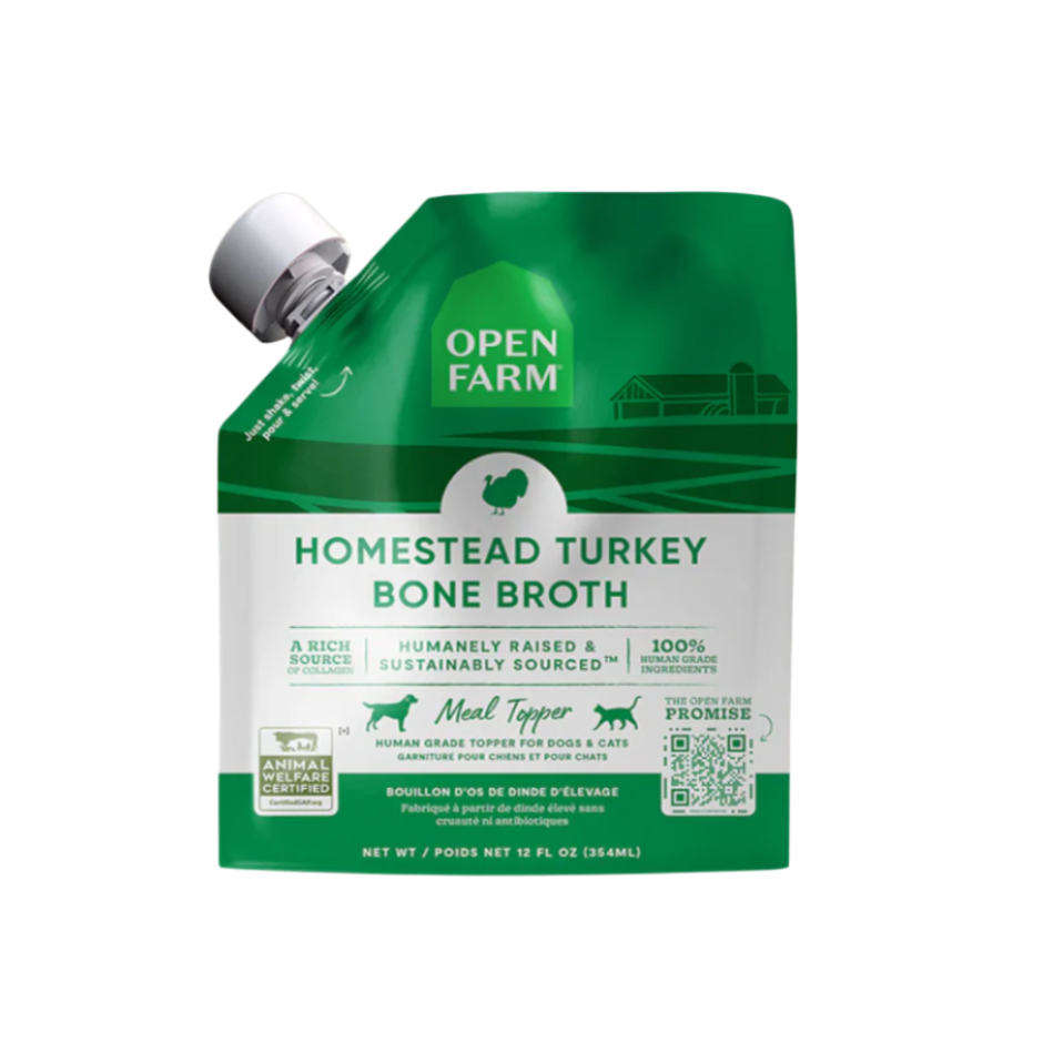 A carton of Open Farm Grass-Fed Beef Bone Broth for Dogs, showing product information and branding.