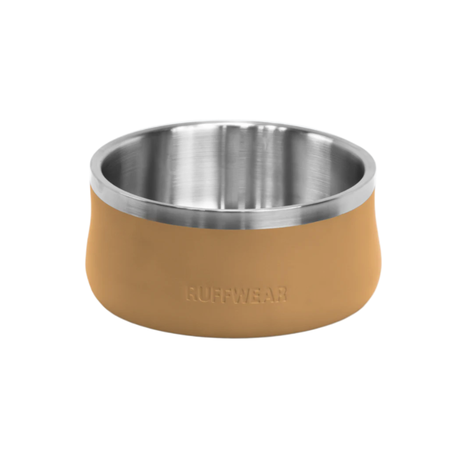 Dog bowl with tan silicone rim and stainless steel interior on a white background