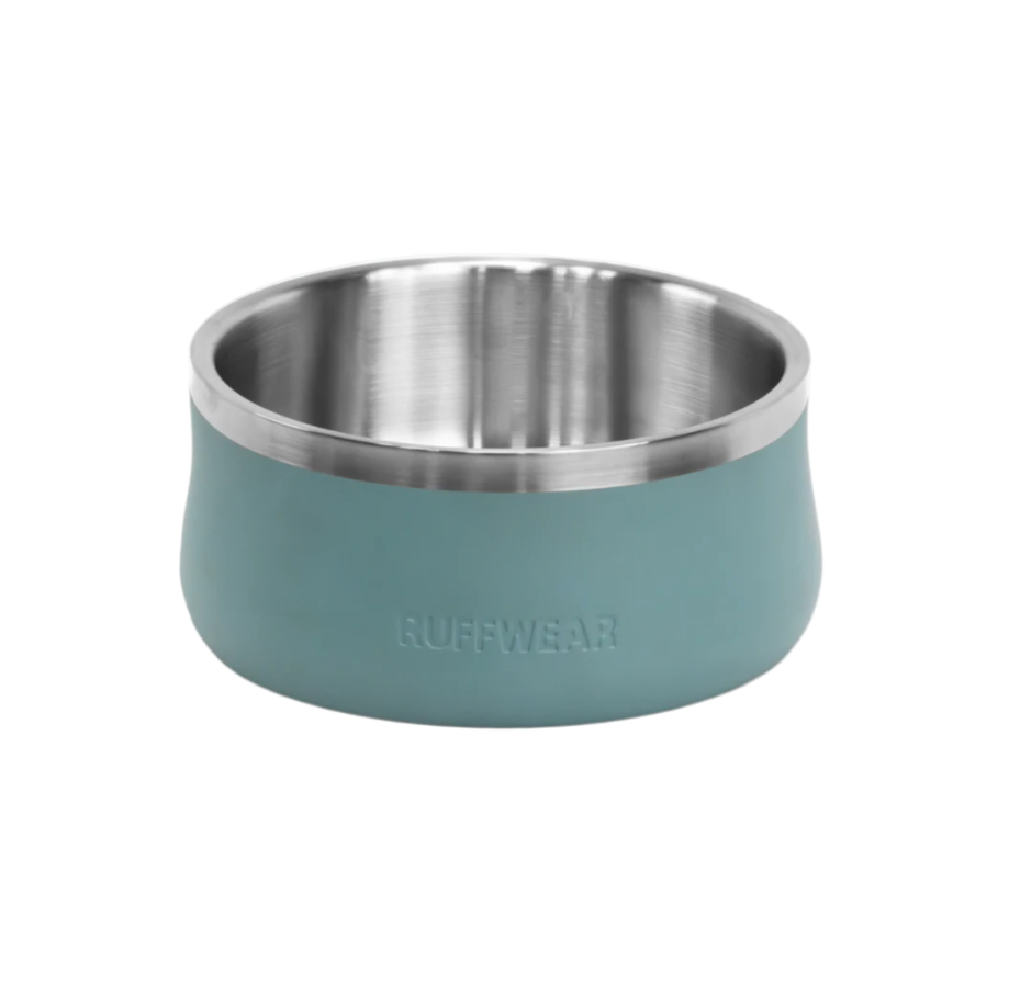 Stainless steel dog bowl with teal base on a white background