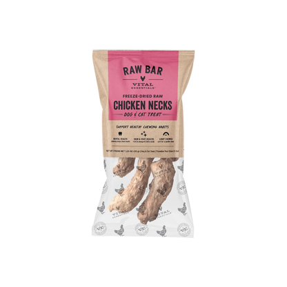 A bag of RAW BAR VITAL ESSENTIALs Freeze-Dried Raw Chicken Necks dog and cat treats, shown on a clean white background. The packaging features a kraft paper style with a prominent pink brand label and a clear lower section displaying the freeze-dried chicken neck treats inside.