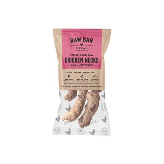 A bag of RAW BAR VITAL ESSENTIALs Freeze-Dried Raw Chicken Necks dog and cat treats, shown on a clean white background. The packaging features a kraft paper style with a prominent pink brand label and a clear lower section displaying the freeze-dried chicken neck treats inside.