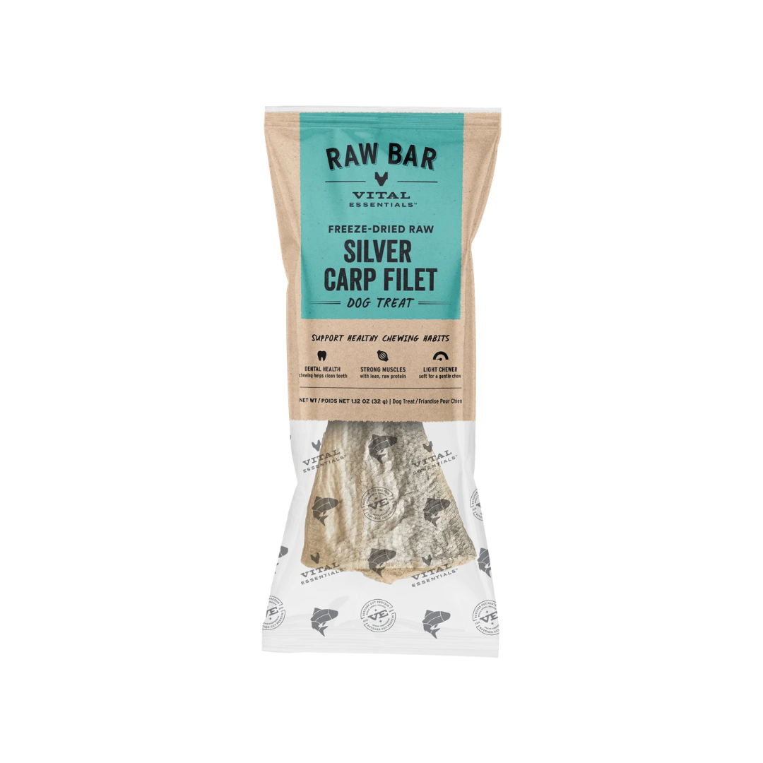 Vital Essentials Raw Bar Silver Carp Filet dog treat in a clear stand-up pouch with a teal and beige label, showing the freeze-dried fish-shaped treat inside.