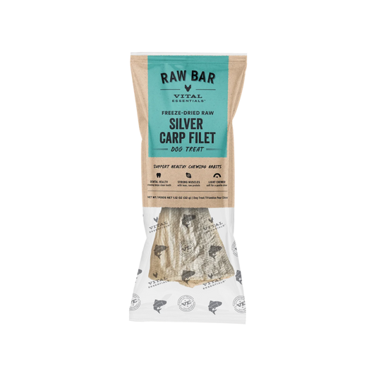 Vital Essentials Raw Bar Silver Carp Filet dog treat in a clear stand-up pouch with a teal and beige label, showing the freeze-dried fish-shaped treat inside.