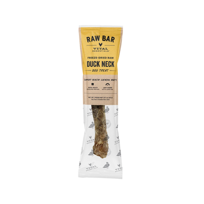 Vital Essentials Raw Bar Freeze-Dried Raw Duck Neck dog treat in its packaging, featuring a yellow and white wrapper with a clear lower section showing the raw meat treat inside.