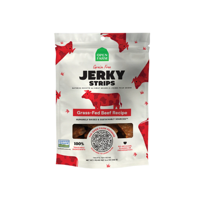 Packaging for Open Farm Jerky Strips with a white background featuring red and black text, and images of cows. The package is labeled as grain-free and gluten-free with a grass-fed beef recipe.