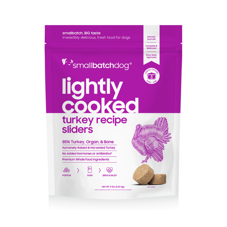 Small batch dog food package with purple and white design on a white background