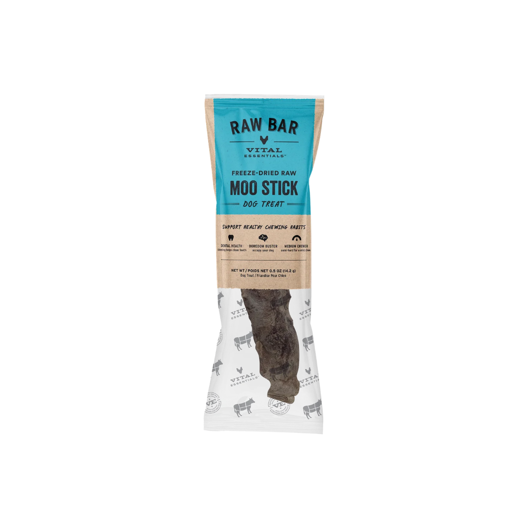 A RAW BAR dog treat stick by Vital Essentials, freeze-dried and moo-stick flavored, shown in its packaging with a turquoise and kraft paper design and a clear window displaying the dark brown treat inside.