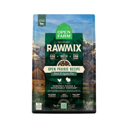 A package of Open Farm RawMix dog food with a grain-free kibble formula. The bag is colorfully illustrated with images of dogs, a chef, and ingredients like meat and grains.