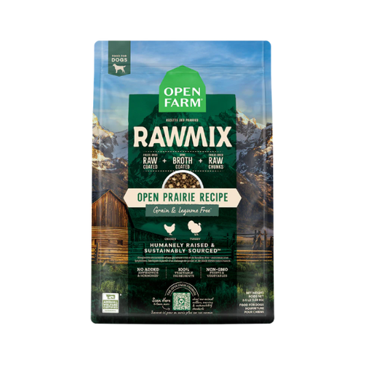 A package of Open Farm RawMix dog food with a grain-free kibble formula. The bag is colorfully illustrated with images of dogs, a chef, and ingredients like meat and grains.