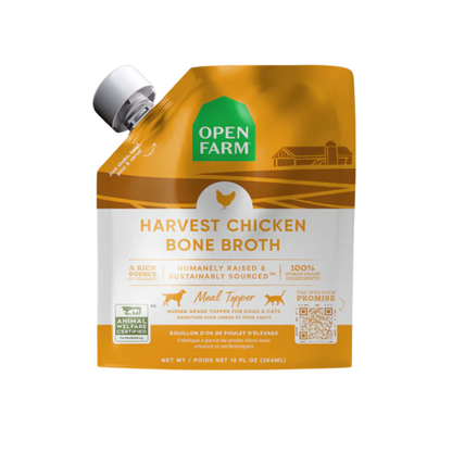 A carton of Open Farm Grass-Fed Beef Bone Broth for Dogs, showing product information and branding.