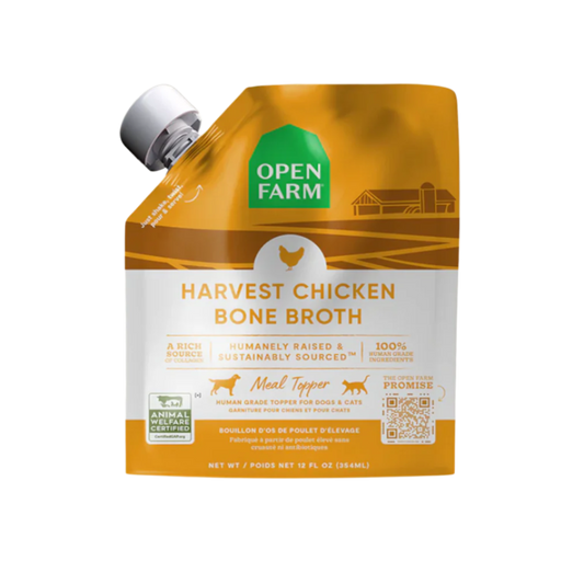 A carton of Open Farm Grass-Fed Beef Bone Broth for Dogs, showing product information and branding.