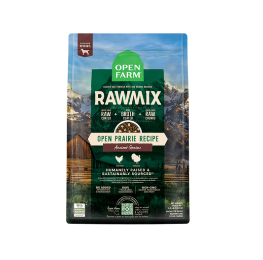 A package of Open Farm RawMix dog food with a grain-free kibble formula. The bag is colorfully illustrated with images of dogs, a chef, and ingredients like meat and grains.