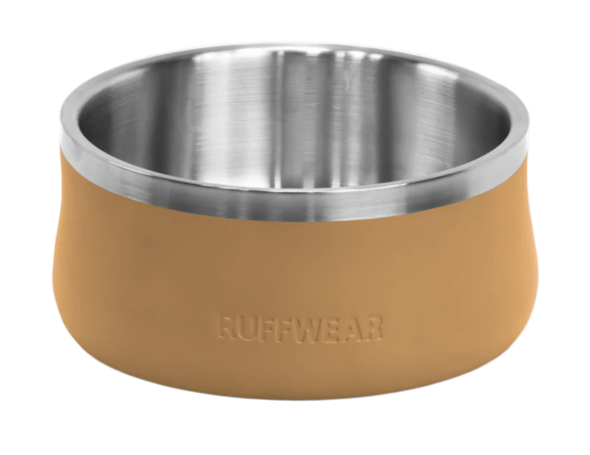 Dog bowl with tan silicone rim and stainless steel interior on a white background