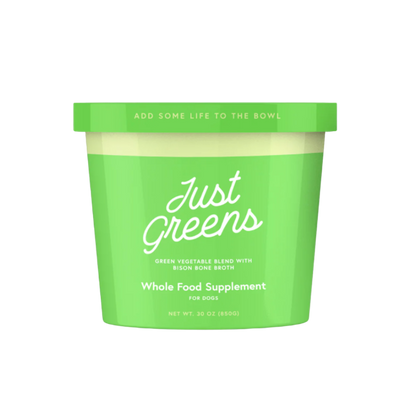 Green container of 'Just Greens' whole food supplement for dogs on a white background