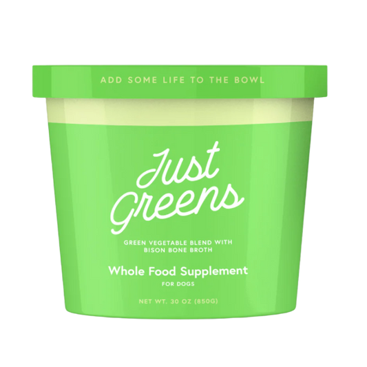 Green container of 'Just Greens' whole food supplement for dogs on a white background