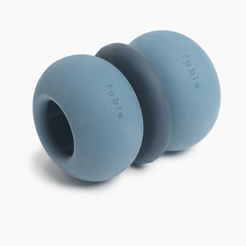 Blue silicone teether with 'fable' branding on a white background