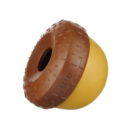 Brown and yellow dog toy with 'Bark' branding on a white background