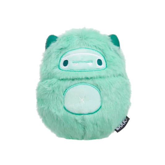 Green plush toy with a tag on a white background