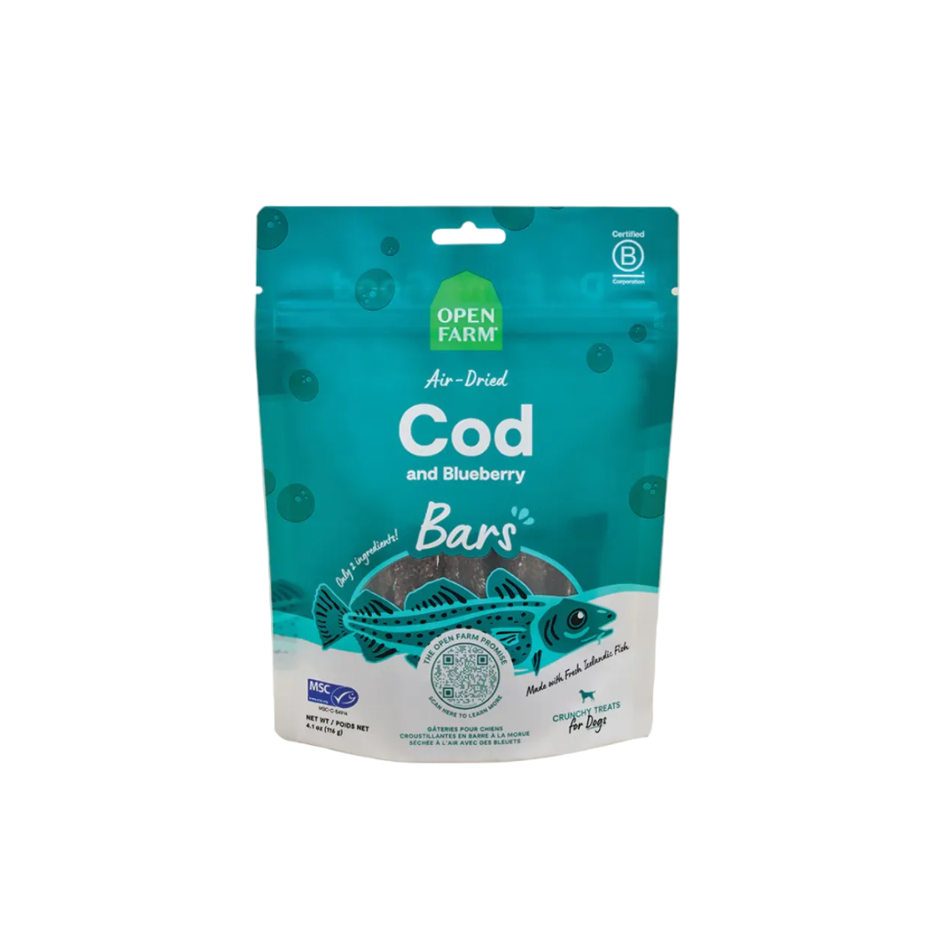 Teal package of Open Farm air-dried cod and blueberry bars on a beige background