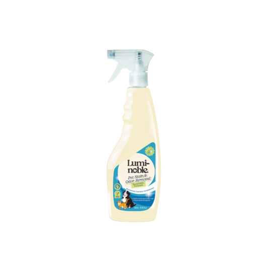 Luminoble pet stain and odor removal spray bottle on a beige background