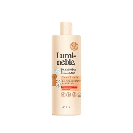 Luminoble sensitive pet shampoo bottle on a beige background