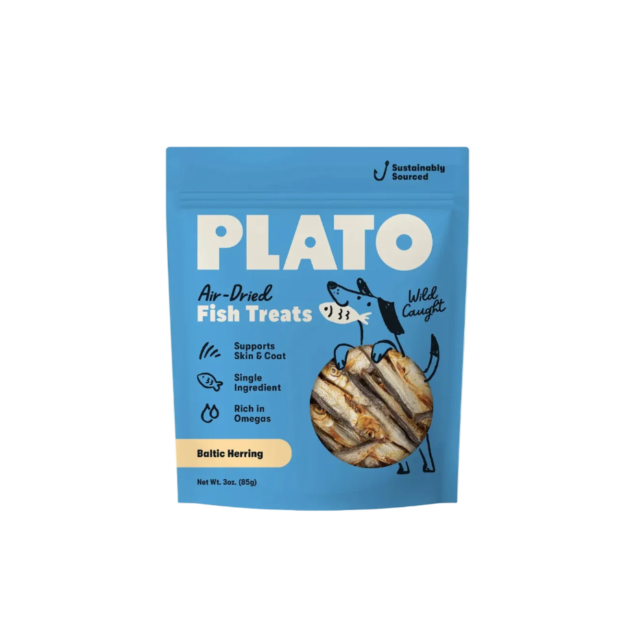 A blue stand-up pouch of Plato Air-Dried Fish Treats, Wild Caught, Baltic Herring flavor, shown against a solid pale beige background.