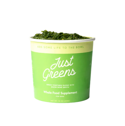 Green container of 'Just Greens' whole food supplement for dogs on a white background