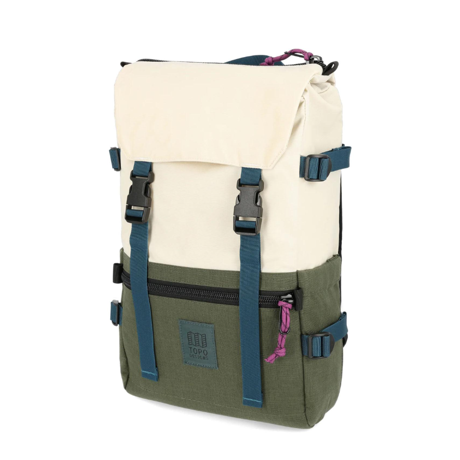 Backpack with beige top section and green bottom section on a white background