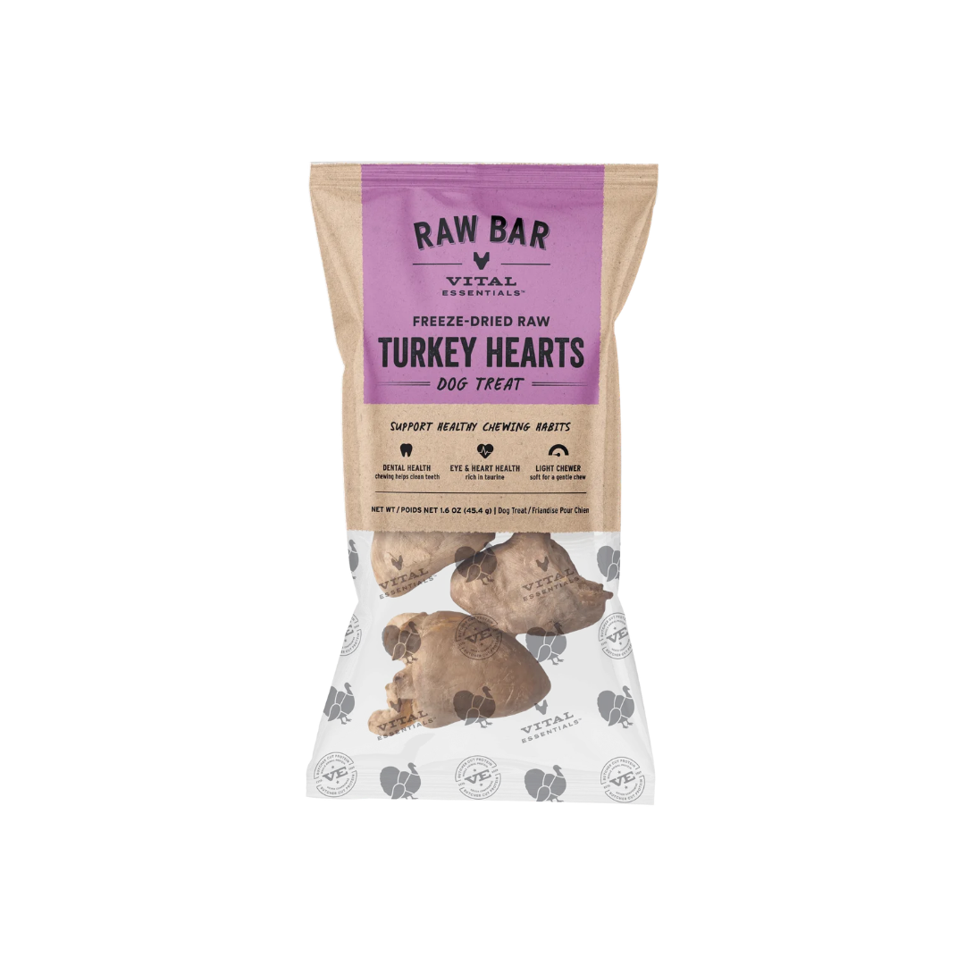 A bag of Vital Essentials Raw Bar Turkey Hearts freeze-dried raw dog treats. The packaging is a kraft paper style with a prominent purple label at the top and a photo of raw turkey hearts near the bottom.