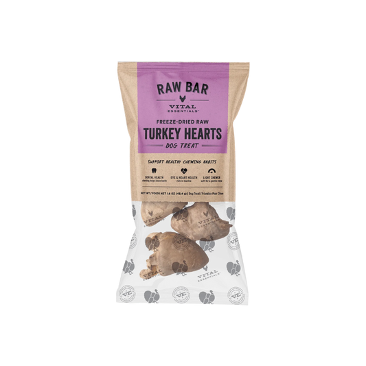A bag of Vital Essentials Raw Bar Turkey Hearts freeze-dried raw dog treats. The packaging is a kraft paper style with a prominent purple label at the top and a photo of raw turkey hearts near the bottom.