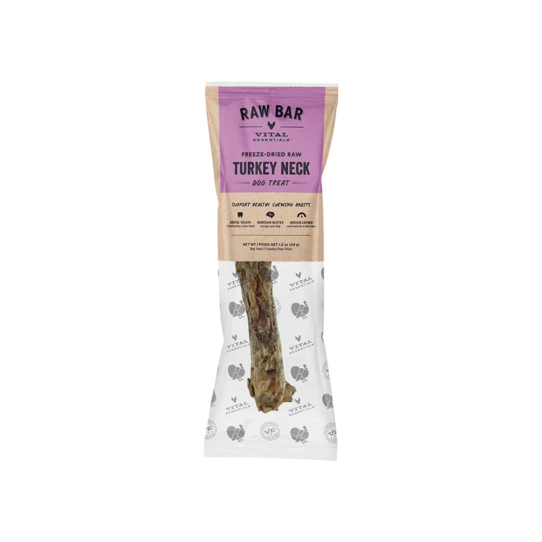 A packaged dog treat from Raw Bar Vital Ingredients, featuring a freeze-dried turkey neck on a white and lavender bag against a solid green background.