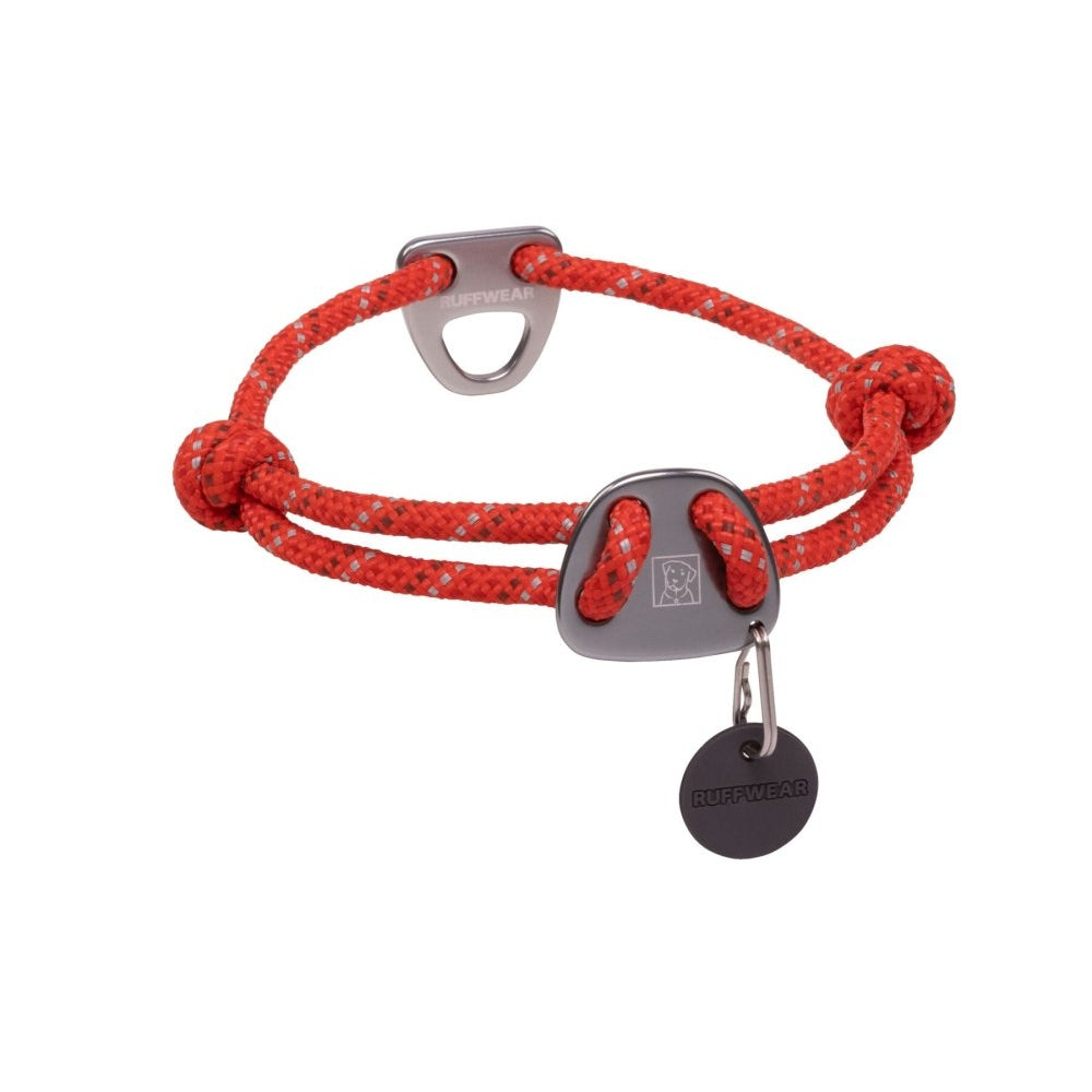 Red braided bracelet with silver clasp and tag on a white background
